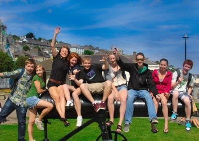 Students relaxing on the Cannon at Cobh Habour